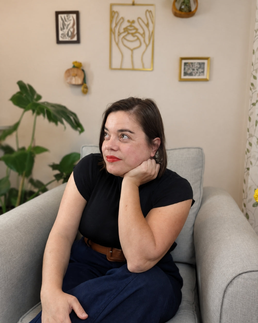 Author Spencer Rose sitting in an armchair at home
